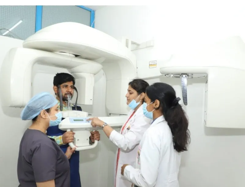 Demonstrating patient positioning in a panoramic and CBCT unit to dental students